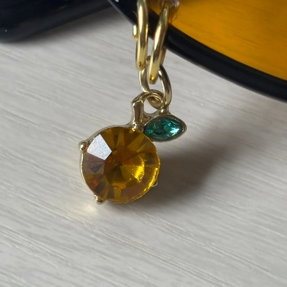 Black Oval Cat Eye Orange Shade Sunglasses Gold Piercings and Orange Fruit Charm - Picture 4 of 5